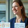 Smiling HR advisor with compliance charts